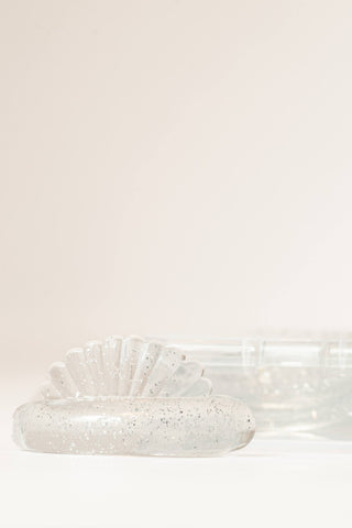 clear glitter lash lift shields displayed on neutral background showing CU-curl shape